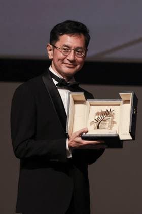 Cannes Palme D Or D Honneur To Studio Ghibli Ceremony DB Goro Miyazaki poses with the award during the ceremony for the Palme D Or D Honneur to Studio Ghibli at the 77th annual Cannes Film Festival at Palais des Festivals on May 20, 2024 in Cannes, France. Photo by David Boyer ABACAPRESS.COM Cannes France  Copyright: xBoyerxDavid ABACAx