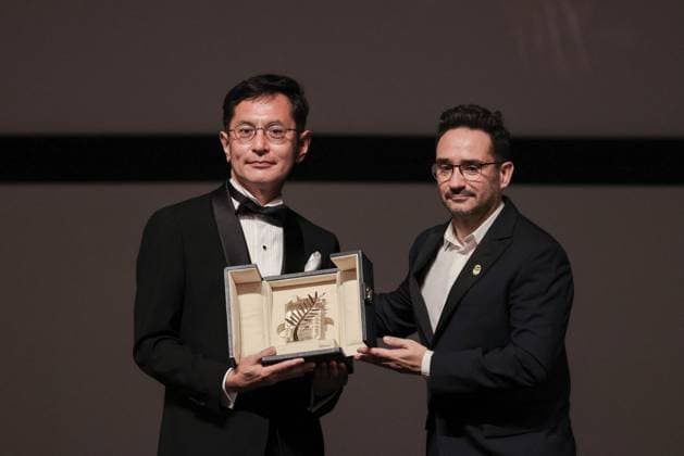 Cannes Palme D Or D Honneur To Studio Ghibli Ceremony DB Goro Miyazaki (L) receives the award from jury member Juan Antonio Bayona (C) and president of the festival Iris Knobloch (R) during the ceremony for the Palme D Or D Honneur to Studio Ghibli at the 77th annual Cannes Film Festival at Palais des Festivals on May 20, 2024 in Cannes, France. Photo by David Boyer ABACAPRESS.COM Cannes France  Copyright: xBoyerxDavid ABACAx