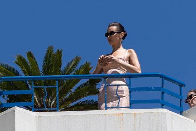 Cannes - Bella Hadid At The Balcony Of Hotel Martinez Bella Hadid is posing for a commercial over the roof terrace of Martinez Hotel during 77th Cannes Film Festival. France, Cannes on May 21, 2024. Photo by ABACAPRESS.COM Cannes France  Copyright: xABACAx