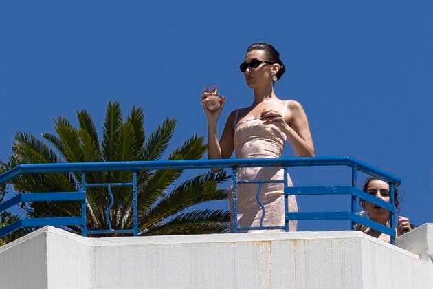 Cannes - Bella Hadid At The Balcony Of Hotel Martinez Bella Hadid is posing for a commercial over the roof terrace of Martinez Hotel during 77th Cannes Film Festival. France, Cannes on May 21, 2024. Photo by ABACAPRESS.COM Cannes France  Copyright: xABACAx