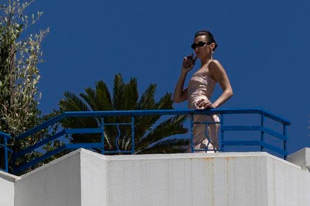 Cannes - Bella Hadid At The Balcony Of Hotel Martinez Bella Hadid is posing for a commercial over the roof terrace of Martinez Hotel during 77th Cannes Film Festival. France, Cannes on May 21, 2024. Photo by ABACAPRESS.COM Cannes France  Copyright: xABACAx