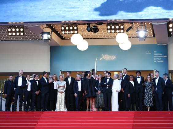 May 21, 2024, Cannes, Cote D azur, France: French athletes of which MARIE-JOSE PEREC, PARIS 2024 President TONY ESTANGUET, THIERRY FREMAUX and IRIS KNOBLOCH carry the Olympic torch up the red carpet ahead of Marcello Mio Premiere screening at the 77th Annual Cannes Film Festival at Palais des Festivals in Cannes, France Cannes France - ZUMAc179 20240521_zep_c179_093 Copyright: xMickaelxChavetx