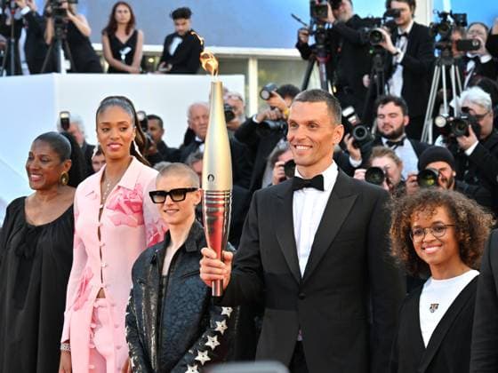 Cannes, 77th Cannes Film Festival 2024, Eighth evening - Red carpet film Marcello Mio - In the photo: The Olympic Torch for Paris 2024 arrives on the Red Carpet Alexis Hanquinquant  Copyright: xManuelexMangiarottix xipa-agencyx xPoolxPhotoxEventsx03x IPA_Agency_IPA46374177