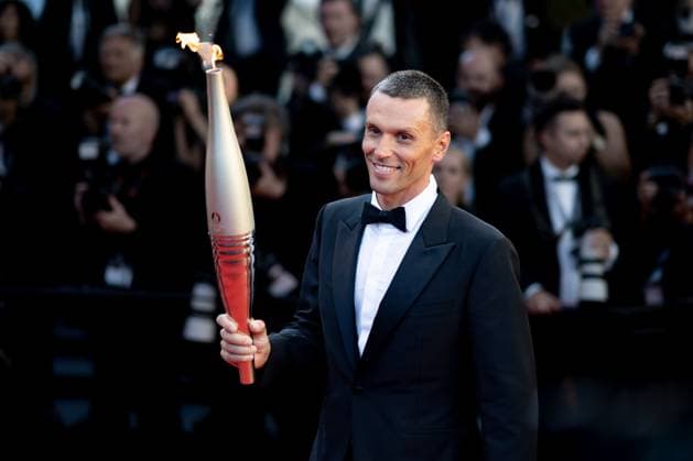 Cannes, France 21th May, 2024 Alexis Hanquinquant carries the Olympic Torch during Marcello Mio Screening red carpet at the 77th annual Cannes Film Festival at Palais des Festivals on May 21, 2024 in Cannes, France CINEMA 77eme Festival de Cannes Red Carpet du film Marcello Mio 21 05 2024 NorbertScanella Panoramic 