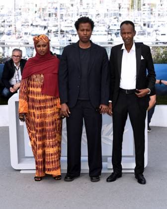 Cannes, France: Cannes, 77th Cannes Film Festival 2024 Photocall film The Village Next To Paradise In the photo: Ahmed Ali Farah, Mo Harawe, Anab Ahmed Ibrahim Cannes France  - ZUMAp169 20240522_zea_p169_105 Copyright: xAlbertoxTerenghix