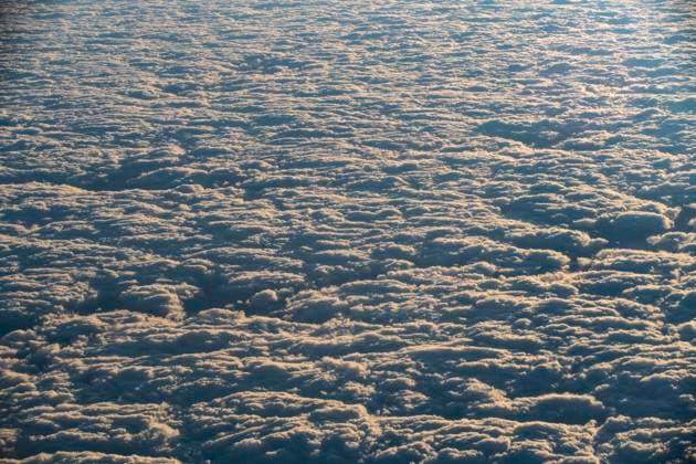 Creative Highlights World Sunrise paints the clouds from above. Argentina, Jujuy Province, Humahuaca R_GASU240520-1435454-01