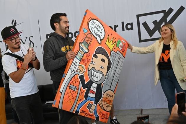 May 22, 2024, Tijuana, Baja California, Mexico: Mexican presidential candidate Jorge Alvarez Maynez of the Citizens Movement party (MC), receives a gift from a supporter, a painting of himself that reads â€oethe new thing has already arrived in Tijuana†during a campaign stop in Tijuana, Baja California, Mexico, where he sought the youth vote at the CETYS University campus on Wednesday, May 22, 2024. Tijuana Mexico - ZUMAm180 20240522_zip_m180_019 Copyright: xCarlosxA.xMorenox