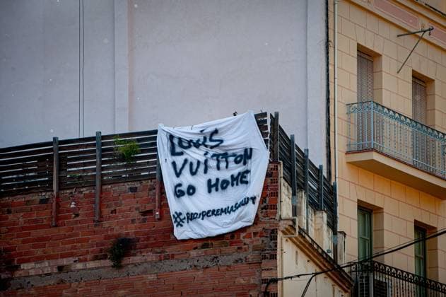 May 23, 2024, Barcelona, Spain: In the Park Guell neighborhood of Barcelona a banner reads Louis Vuitton go home. Barcelona residents gathered around Park GoÂ¼ell in Barcelona against the Louis Vuitton fashion show and protesting various social issues such as mass tourism, gentrification, animal rights or the commercialization and privatization of public spaces by the city council. Barcelona Spain - ZUMAb137 20240523_fap_b137_004 Copyright: xJordixBoixareux