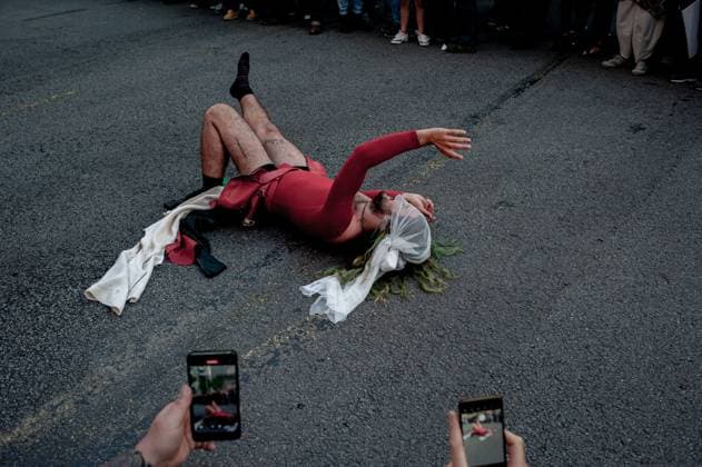 May 23, 2024, Barcelona, Spain: A protester dressed as fashion model performs satirical way outside the Barcelona s Park Guell where Louis Vuitton fashion show was taking place. Barcelona residents gathered around Park GoÂ¼ell in Barcelona against the Louis Vuitton fashion show and protesting various social issues such as mass tourism, gentrification, animal rights or the commercialization and privatization of public spaces by the city council. Barcelona Spain - ZUMAb137 20240523_fap_b137_009 Copyright: xJordixBoixareux