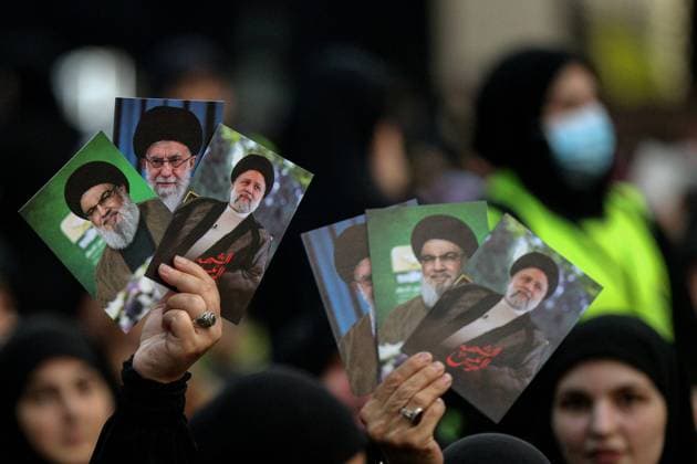 May 24, 2024, Beirut, Beirut, Lebanon: Pro-Iranian Hezbollah supporters display pictures of the party Secretary General Hassan Nasrallah, Iranian Supreme leader Ali Khamenei and late Iranian President Ebrahim Raisi as they attend a mass rally in Beirut southern suburb to mark the death of Raisi earlier this week. Raisi, Abdollahian and other officials were killed, in a helicopter crash in Iran. Beirut Lebanon - ZUMAn313 20240524_zip_n313_007 Copyright: xMarwanxNaamanix