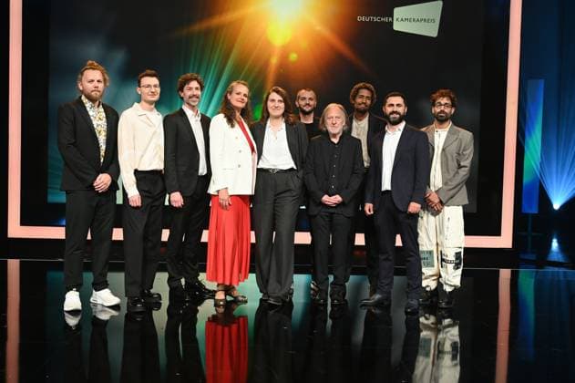 Award winners Lukas Wunschik, Markus Ott, Nicolai Mehring, Anne Jünemann, Yana Höhnerbach, Philipp Straetker, Rainer Klausmann, Noah Böhm, Daniel Guliyev, Christopher Aoun, l r, posing on stage at the award ceremony 34 German Camera Award