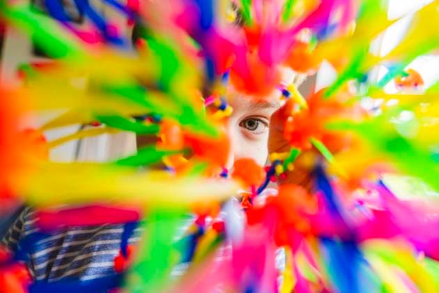 Creative Highlights Symbolbilder Curious boy looking through colorful expandable breathing ball model released, Symbolfoto property released, IHF01952