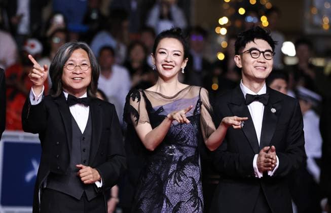 (240525) -- CANNES, May 25, 2024 -- Director Peter Ho-sun Chan (L), actress Zhang Ziyi (C) and actor Da Peng arrive for the screening of the film She s got no name at the 77th edition of the Cannes Film Festival in Cannes, southern France, on May 24, 2024. ) FRANCE-CANNES-FILM FESTIVAL-SHE S GOT NO NAME GaoxJing 