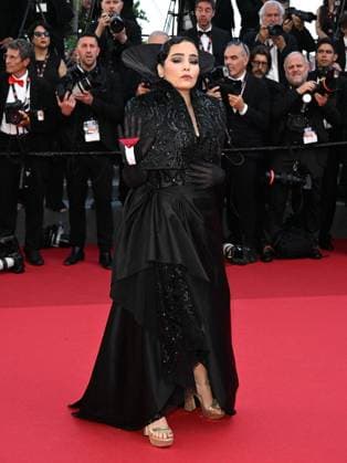 **Cannes, 77th Cannes Film Festival 2024, Final Night, Red Carpet Closing Ceremony. 77th Cannes Film Festival 2024, Final Night, Red Carpet Closing Ceremony. In the photo: Asmae El Moudir with the Palestine flag on her glove Cannes France  Copyright: xIPA ABACAx