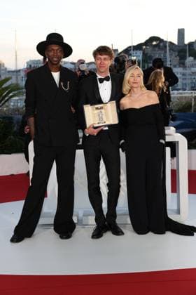 Cannes - Palme D Or Winners Photocall President of the Jury CamÃ ra D or Baloji, Winner of the Camera d Or Award for Armand Halfdan Ullmann Tondel, and President of the Jury CamÃ ra D or Emmanuelle BÃ art pose during the Palme D Or Winners Photocall at the 77th annual Cannes Film Festival at Palais des Festivals on May 25, 2024 in Cannes, France. Photo by Shootpix ABACAPRESS.COM Cannes France  Copyright: xShootpix ABACAx