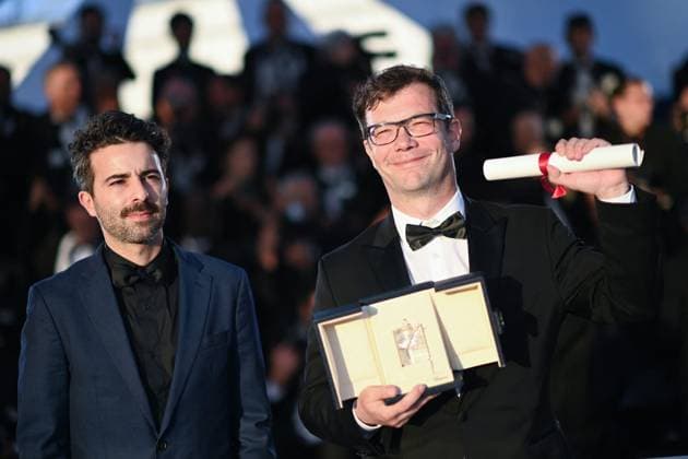 Cannes Winners Photocall Nebojsa Slijepcevic and a guest pose with the Short Film Palme D Or Award for The Man Who Could Not Remain Silent during the Winners Photocall as part of the 77th Cannes International Film Festival in Cannes, France on May 25, 2024. Photo by Aurore Marechal ABACAPRESS.COM Cannes France  Copyright: xMarechalxAurore ABACAx