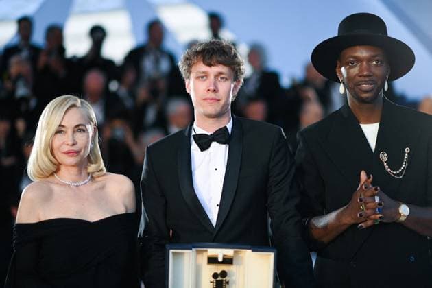 Cannes Winners Photocall President of the Jury Camera D or Baloji, Winner of the Camera d Or Award for Armand Halfdan Ullmann Tondel, and President of the Jury CamÃ ra D or Emmanuelle Beart pose sas part of the 77th Cannes International Film Festival in Cannes, France on May 25, 2024. Photo by Aurore Marechal ABACAPRESS.COM Cannes France  Copyright: xMarechalxAurore ABACAx