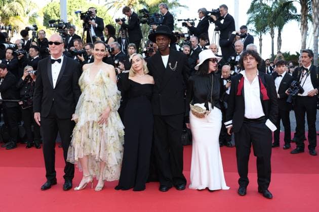 Cannes - Closing Ceremony Arrivals Members of the Camera d Or jury French deputy general manager HR and support TSF cinema Pascal Buron, Belgian director, screenwriter Zoe Wittock, French actress, director, producer and President of the Camera d Or jury Emmanuelle Beart, Congolese and Belgian director, songwriter, artistic director and President of the Camera d Or jury Baloji, French cinema section head ebra, treasurer sfcc Nathalie Chifflet and French director of photography Gilles Porte arrive for the Closing Ceremony of the 77th edition of the Cannes Film Festival in Cannes, southern France, on May 25, 2024. Photo by Shootpix ABACAPRESS.COM Cannes France  Copyright: xShootpix ABACAx