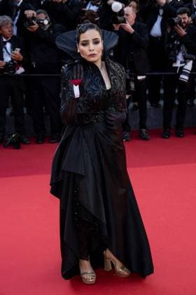 Cannes - Asmae El Moudir with Palestine Flag at Closing Ceremony AAR Moroccan film director Asmae El Moudir, member of ?Un Certain Regard? jury, with a Palestinian flag on her palm, as a call for ceasefire, arrives for the closing ceremony of the 77th Cannes Film Festival, in Cannes, France, on May 25, 2024. Photo by Ammar Abd Rabbo ABACAPRESS.COM Cannes France  Copyright: xAbdxRabboxAmmar ABACAx