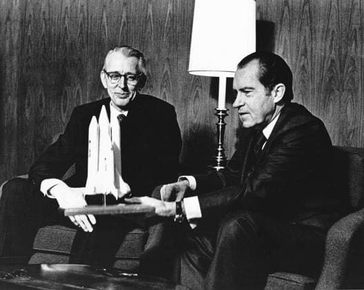 Nixon and Fletcher Discuss the Proposed Space Shuttle United States President Richard M. Nixon, right, and Dr. James C. Fletcher, Administrator of the National Aeronautics and Space Administration discuss the proposed space shuttle vehicle at San Clemente, California, January 5, 1972. The President announced that day the United States should proceed at once with the development of an entirely new type of space transportation system designed to help transform the space frontier of the 1970s into familiar territory, easily accessible for human endeavor in the 1980s and ˜90s. Credit: NASA via CNP San Clemente California United States of America EDITORIAL USE ONLY Copyright: xx 72-H-32 NASAxviaxCNPx cnpphotos258450