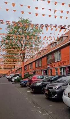 Family turns entire street ORANGE to celebrate start of Euros Story from Jam Press (Euros Celebration) Pictured: Video grab of the orange street ready to celebrate the Euros. Family turns entire street ORANGE to celebrate start of Euros An entire street has turned orange in celebration of the beginning of the UEFA Euros 2024. The road has been decorated with flags, while buildings and trees have been draped with tarpaulin. The thrifty family responsible says they have been stringing up decorations every two years since 1988, and around 15 of their friends come to help them. It has already taken them six weeks - and they won™t stop until the day of the first match. There are still some flags to hang - in total there will be 65 k  Copyright: xJamxPressxVid @marktweg_oranjestraat