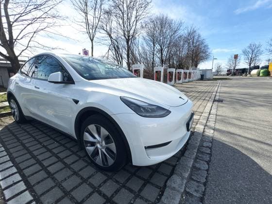Türkheim, Bavaria, Germany - March 3, 2024: Tesla Model Y at a Tesla charging station, Supercharger fast charging station in Türkheim