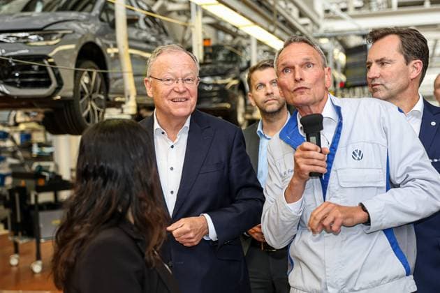 Ceremony 50 years of Golf production at Volkswagen in Wolfsburg, VW production hall, f r , Thomas Schäfer, CEO of the Volkswagen Passenger Cars brand, Member of the Board of Management of Volkswagen AG and Head of the Core brand group, back , Dr Rainer Fessel, VW plant Ceremony 50 years of Golf production, Wolfsburg VW plant Wolfsburg Lower Saxony Germany
