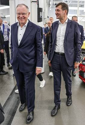 Celebration of 50 years of Golf production at Volkswagen in Wolfsburg Celebration of 50 years of Golf production, event room with various VW Golf cars, from left Nds Minister President Stephan Weil SPD , Gunnar Kilian, Member of the Board of Management of Volkswagen AG for Human Resources and Trucks Wolfsburg VW plant Wolfsburg Lower Saxony Germany