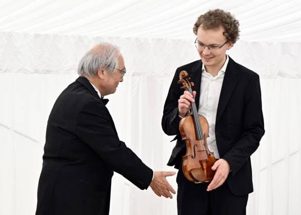 First prize Dmytro Udovychenko of Ukraine receives the Huggins 1708 Stradivarius of the Nippon Music Foundation during the award ceremony of the Queen Elisabeth Violin Competition 2024, at the Queen Elisabeth Music Chapel (Chapelle Musicale Reine Elisabeth - Muziekkapel Koningin Elisabeth), in Waterloo on Tuesday 04 June 2024.  ERICxLALMAND 93955820