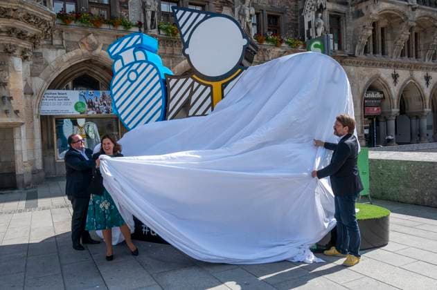 Mayor Verena Dietl, sports officer Florian Kraus and business officer Clemens Baumgäaertner unveil the Munich Kindl on Marienplatz, which will be part of the UEFA EURO 2024 Spectacular in Munich The larger-than-life figure is intended to invite all fans and visitors to linger and come together