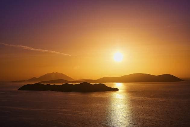 Violet-golden sunset over calm sea and silhouetted islands, Makri Island, Alimia Island, Chalki Island, Kritinia Castle, St Johns Castle, Kritinia, Rhodes, Dodecanese, Greek Islands, Greece, Europe *** Violet Golden Sunset Over Calm Sea and silhouetted islands, Makri Iceland, Amila Iceland, Halki Iceland, Kritinia Castle, St Johns Castle, Kritinia, Rhodes, Dodecanese, Greek Iceland, Greece, Europe Copyright: imageBROKER RalfxAdler ibxraa10751042.jpg