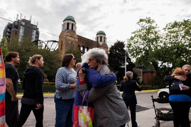 June 11, 2024, Toronto, On, CANADA: Parishioners and community members gather out front of the burnt out St. Anne s Anglican Church, during an evening vigil to mourn the loss of the church following a Sunday morning fire, Tuesday, June 11, 2024. Toronto CANADA  - ZUMAc35_ 20240611_zaf_c35_094 Copyright: xColexBurstonx