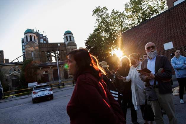 June 11, 2024, Toronto, On, CANADA: Parishioners and community members gather out front of the burnt out St. Anne s Anglican Church, during an evening vigil to mourn the loss of the church following a Sunday morning fire, Tuesday, June 11, 2024. Toronto CANADA  - ZUMAc35_ 20240611_zaf_c35_099 Copyright: xColexBurstonx