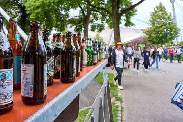 Munich, Bavaria, Germany - June 14, 2024: empty beer bottles after the Euro 2024 soccer match in Munich, concept alcohol, or beer and pollution