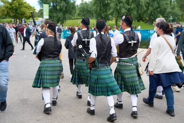 Munich, Bavaria, Germany - June 14, 2024: Traditional Scots with kilts and bagpipes at the international match between Germany and Scotland in Munich