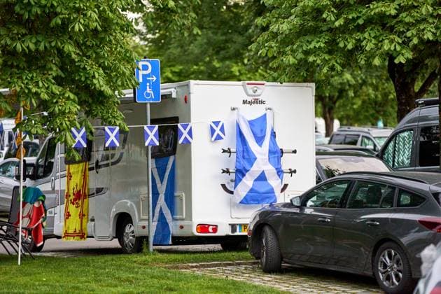 Munich, Bavaria, Germany - June 14, 2024: Mobile home in a parking lot in Munich, decorated with Scottish flags. Home for soccer fans from Scotland during UEFA EURO 2024