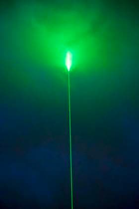 Green laser beam in the night sky over Munich, during the half-time break of the European Championship opening match between Germany and Scotland, June 14, 2024 Germany, Munich, June 14, 2024, green laser beam in the night sky over Munich, Aston Martin advertising campaign during the half-time break of the European Championship opening match between Germany