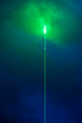 Green laser beam in the night sky over Munich, during the half-time break of the European Championship opening match between Germany and Scotland, June 14, 2024 Germany, Munich, June 14, 2024, green laser beam in the night sky over Munich, Aston Martin advertising campaign during the half-time break of the European Championship opening match between Germany