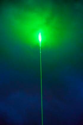 Green laser beam in the night sky over Munich, during the half-time break of the European Championship opening match between Germany and Scotland, June 14, 2024 Germany, Munich, June 14, 2024, green laser beam in the night sky over Munich, Aston Martin advertising campaign during the half-time break of the European Championship opening match between Germany