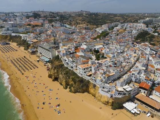 City on a hill with a lively sandy beach on the coast and numerous buildings, aerial view, Albufeira, Faro, Algarve, Portugal, Europe *** City ON a Hill With a Lively Sandy Beach ON The Coast and numerous buildings, Aerial view, Albufeira, Faro, Algarve, Portugal, Europe Copyright: imageBROKER FraukexScholz ibxsco10780203.jpg