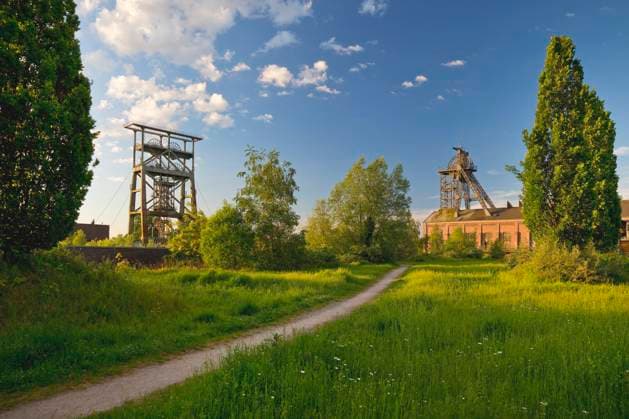 District Park Gneisenau with the both Foerdergeruesten the closed down Colliery, Germany, North Rhine Westphalia, Ruhr area, Dortmund Gneisenau Park With The Two headframes of The Disused colliery, Germany, North Rhine Westphalia, Ruhr Area, Dortmund BLWS710637 Copyright: xblickwinkel S.xZiesex