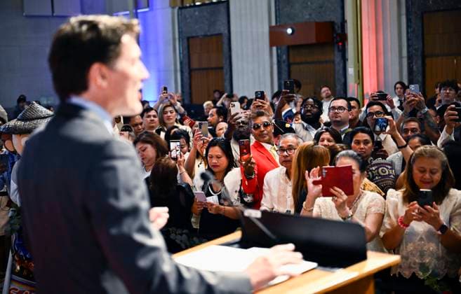 June 17, 2024, Ottawa, On, CAN: Attendees take photos with their phones as Prime Minister Justin Trudeau makes remarks at the Filipino Heritage Month reception, in Ottawa, on Monday, June 17, 2024. Ottawa CAN  - ZUMAc35_ 20240617_zaf_c35_062 Copyright: xJustinxTangx