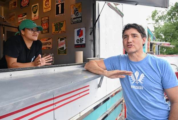 June 23, 2024, Chateauguay, Pq, Canada: Prime Minister Justin Trudeau talks with a food truck worker as he visits a poutine festival in Chateauguay, Que., Sunday, June 23, 2024. Chateauguay Canada  - ZUMAc35_ 20240623_zaf_c35_004 Copyright: xGrahamxHughesx