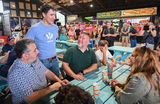 June 23, 2024, Chateauguay, Pq, Canada: Prime Minister Justin Trudeau talks with people as he visits a poutine festival in Chateauguay, Que., Sunday, June 23, 2024. Chateauguay Canada  - ZUMAc35_ 20240623_zaf_c35_007 Copyright: xGrahamxHughesx