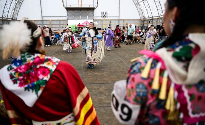 June 23, 2024, Ottawa, On, CAN: Dancers watch others compete in the Summer Solstice Indigenous Festival s 2024 Competition Pow Wow at Madahoki Farm in Ottawa, Sunday, June 23, 2024. Ottawa CAN  - ZUMAc35_ 20240623_zaf_c35_015 Copyright: xJustinxTangx