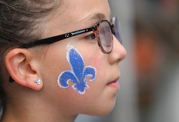 June 23, 2024, Montreal, Pq, Canada: A young girl wears a fleur-de-lys on her face during a FÃªte Nationale event in Montreal, Sunday, June 23, 2024. Montreal Canada  - ZUMAc35_ 20240623_zaf_c35_025 Copyright: xGrahamxHughesx