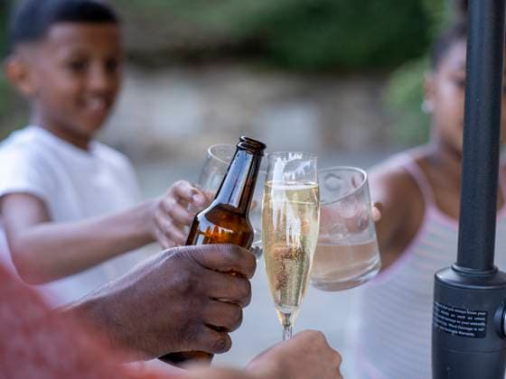 Family with children (8-9, 10-11) raising toast model released Copyright: xCulturaxCreativex