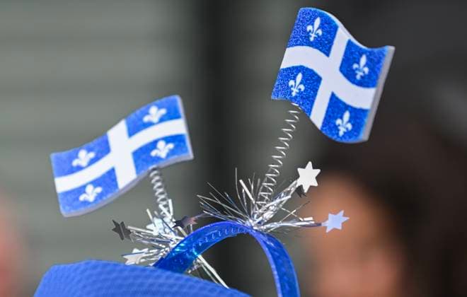June 24, 2024, Trois-RivieRes, Pq, Canada: A person wears miniature Quebec flags on a hat during a FÃªte Nationale event in Trois-Rivieres, Que., Monday, June 24, 2024. Trois-RivieRes Canada  - ZUMAc35_ 20240624_zaf_c35_046 Copyright: xGrahamxHughesx