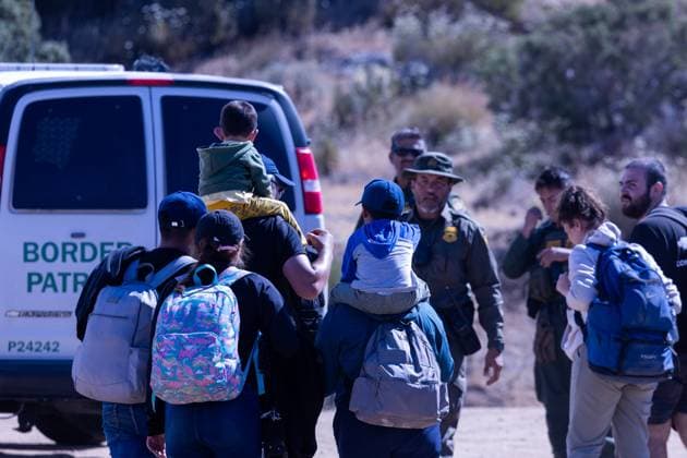 JACUMBA HOT SPRINGS, CA - JUNE 24: Migrants are processed by U.S. Border Patrol agents after crossing into U.S. from Mexico through an abandoned railroad on June 24, 2024 in Jacumba Hot Springs, San Diego, California.  Copyright: xVCGx 111503898911