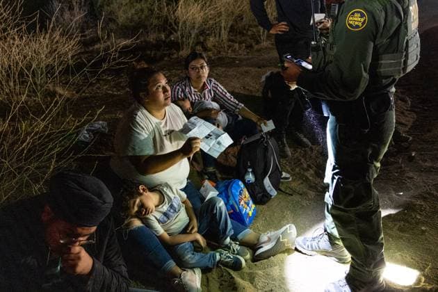 JACUMBA HOT SPRINGS, CA - JUNE 24: Migrants are processed by U.S. Border Patrol agents after crossing into U.S. from Mexico through an abandoned railroad on June 24, 2024 in Jacumba Hot Springs, San Diego, California.  Copyright: xVCGx 111503898902